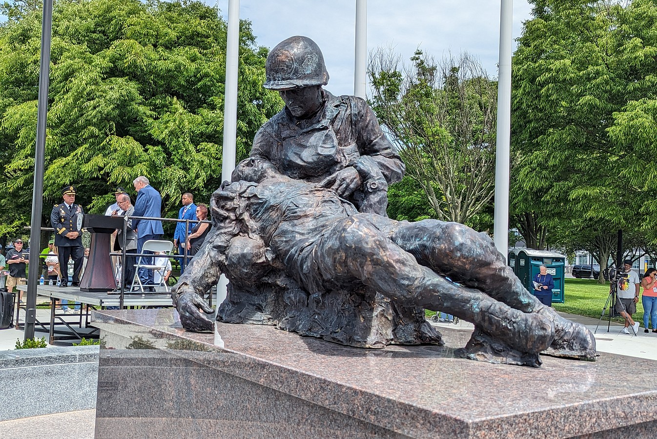 The statue depicts Staff Sgt. Bernie Friedenberg attending to a wounded soldier.
