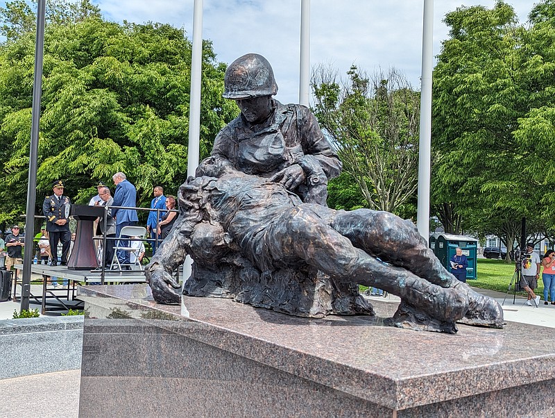 The statue depicts Staff Sgt. Bernie Friedenberg attending to a wounded soldier.