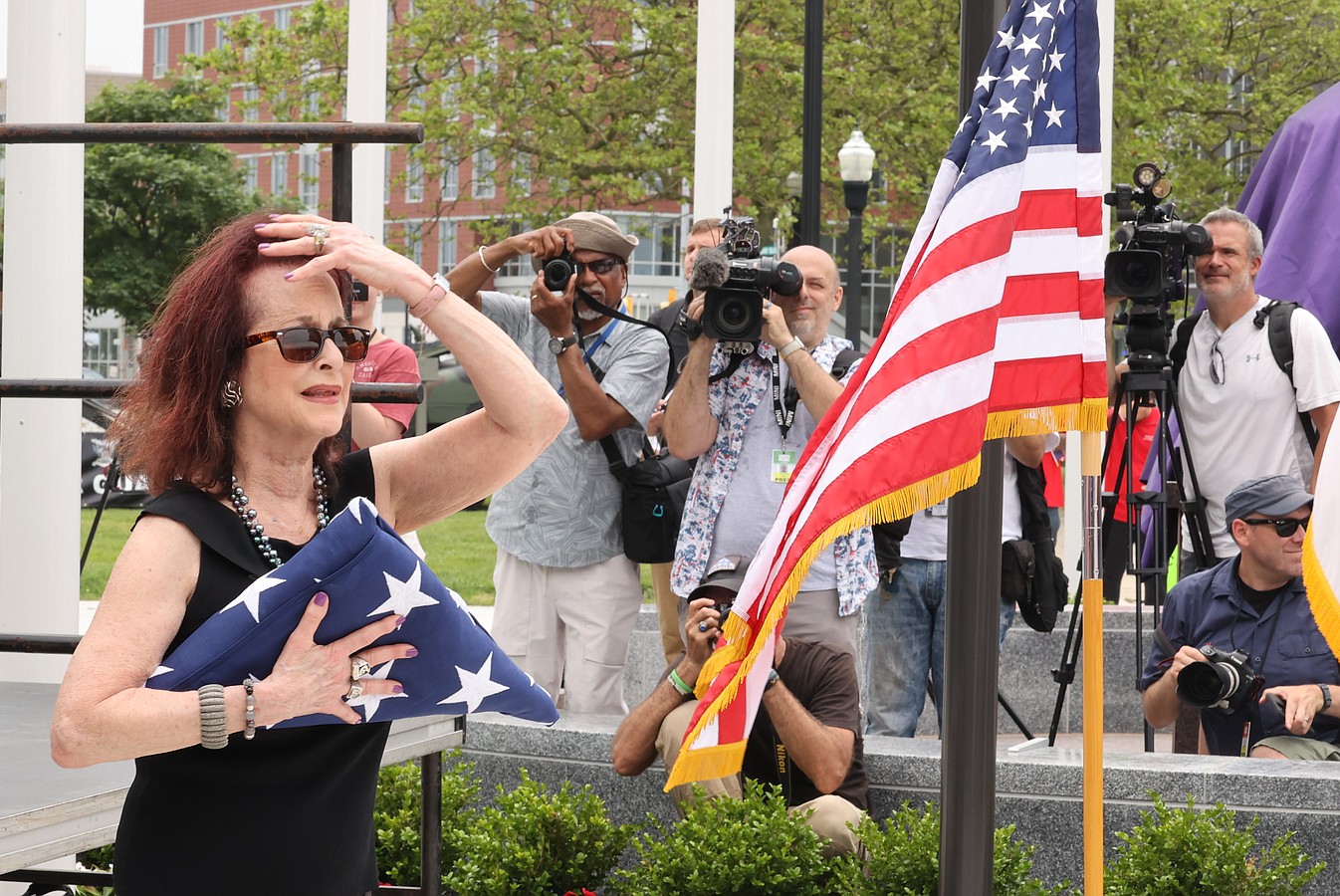 Susan Friedenberg was overcome with emotion after the flag was presented.