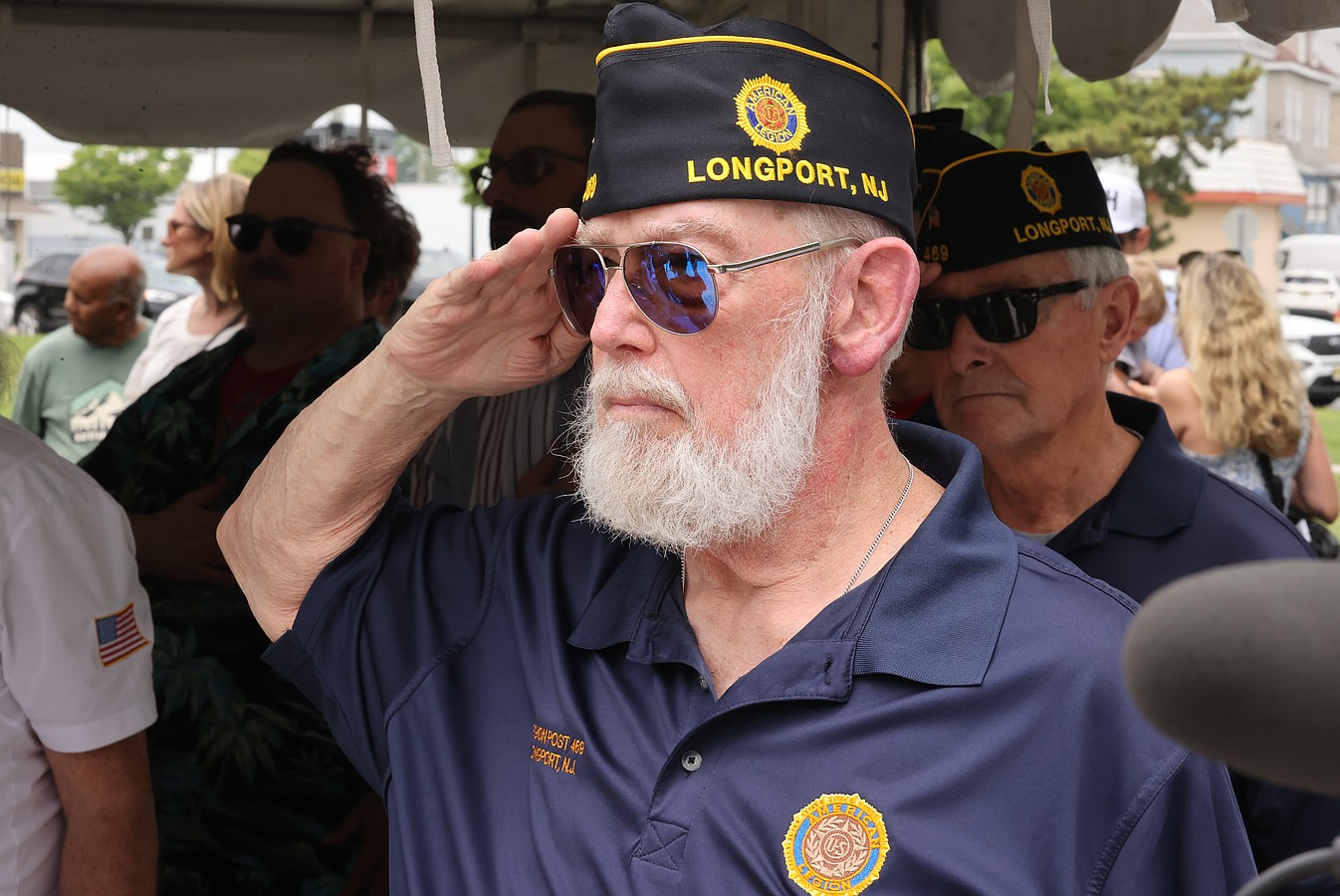 A veteran from Longport salutes.