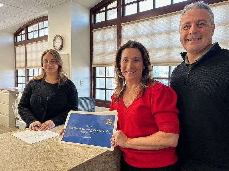 Amie Vaules is accompanied by her husband, Michael, when she turned in her 
nominating petitions in February. (Photo courtesy of Amie Vaules)