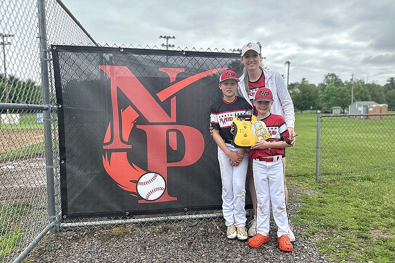 Erin Thurston and her children at the North Penn Little League field.