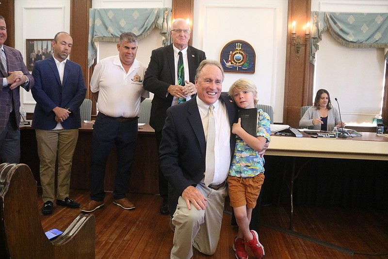 Councilman Sean Barnes hugs his 7-year-old-nephew, Milo Sean Barnes, after the swearing-in ceremony.