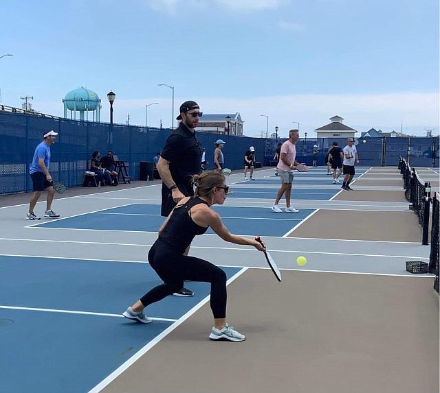 Connor Barwin and his wife, Laura, get in on the pickleball action at the Make The World Better fundraising tournament.