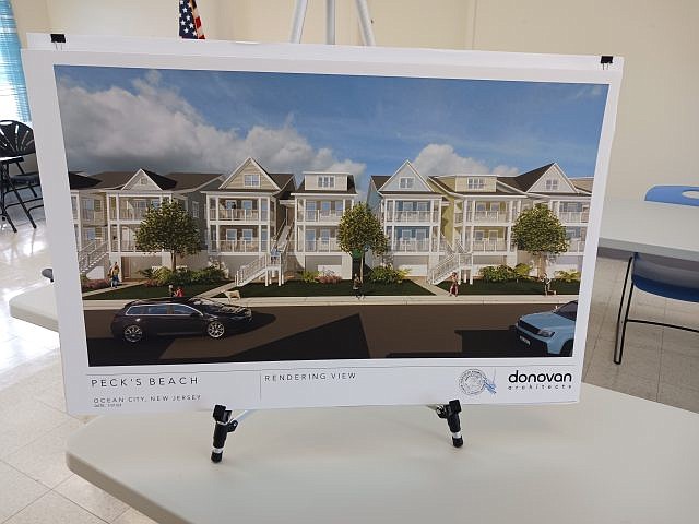 An architectural rendering depicts the duplex-style design of the 60-unit Pecks Beach Village housing development.