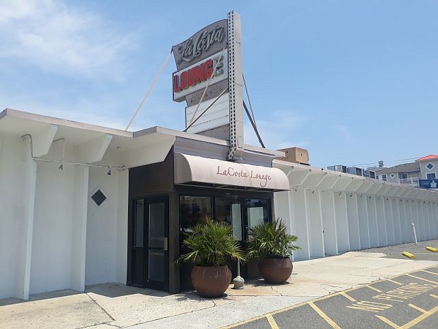 The LaCosta Lounge sign, a remnant of the legendary bar that preceded the Ludlam hotel, sells for $2,700 in the auction.