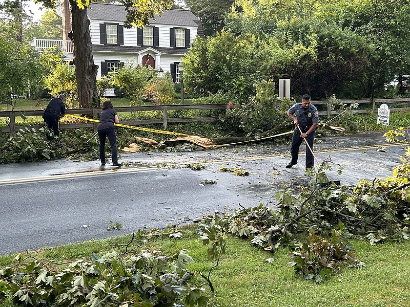 Residents and Upper Gwynedd Police team up Sunday afternoon following a fast-moving, damaging storm in the area.