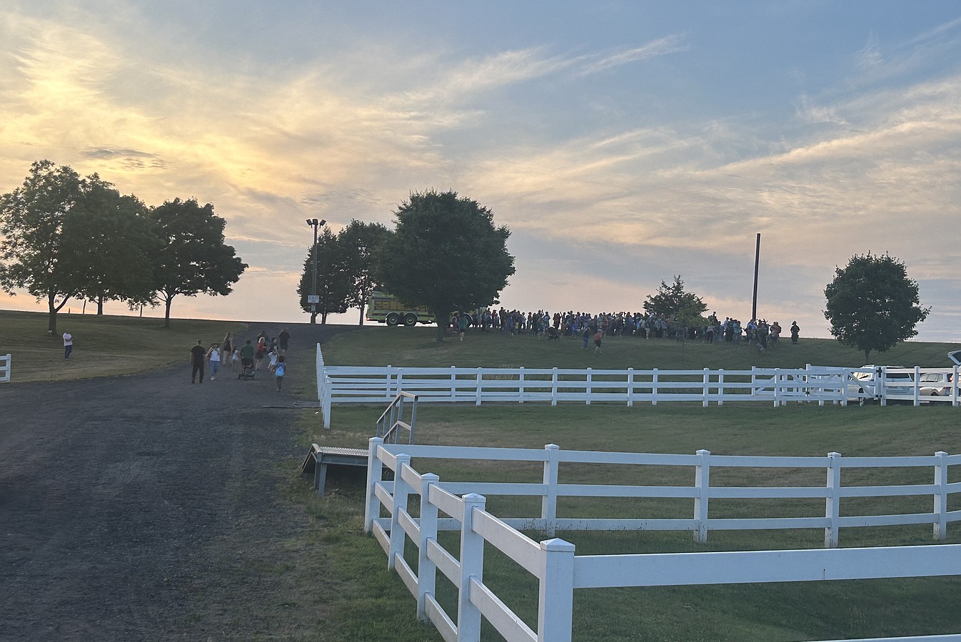 A crowd awaits the arrival of the JeffStat helicopter.