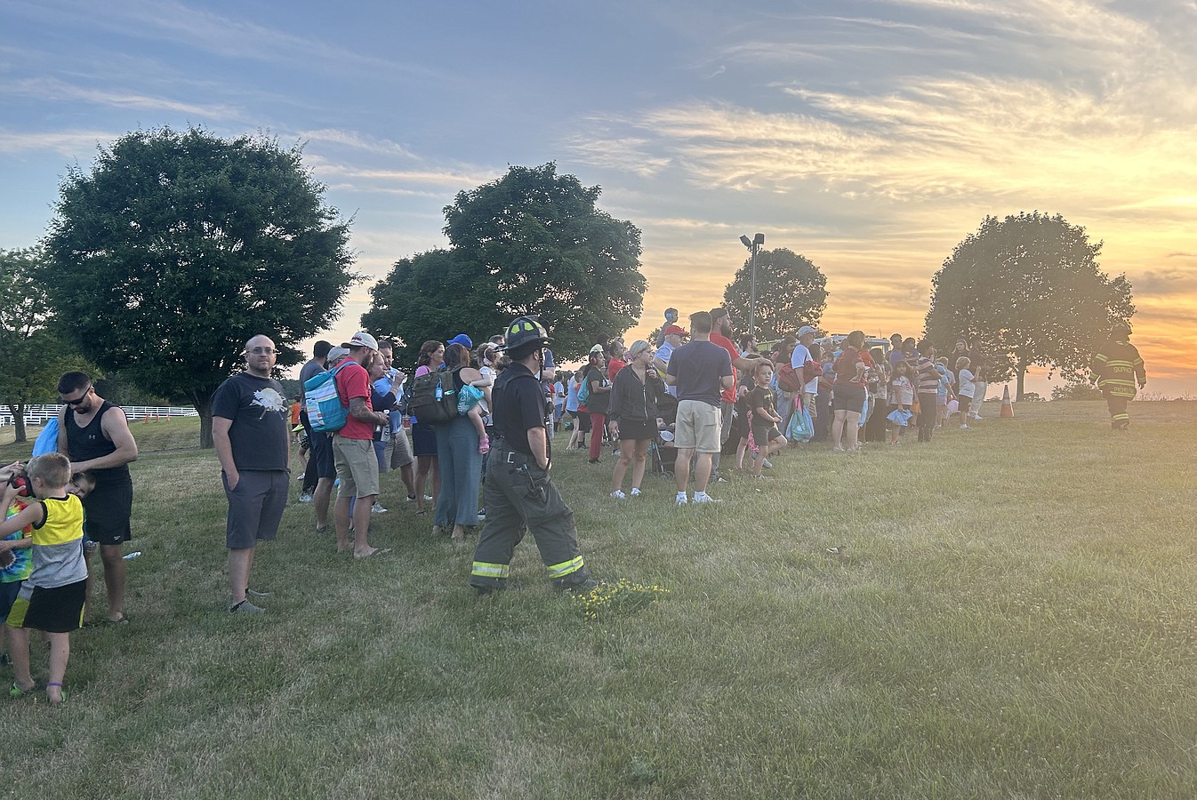 Firefighters keep the crowd safe as they await the JeffStat helicopter.