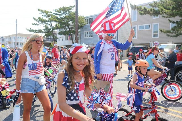 Families deck out in red, white and blue for the Fourth of July parade in the south end.