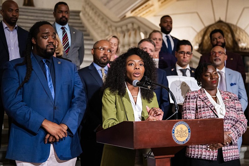 Rep. Ismail Smith-Wade-El (left), Rep. Lindsay Powell (at podium) and House Speaker Joanna McClinton (right) speak out against the U.S. Supreme Court’s recent ruling on homelessness.