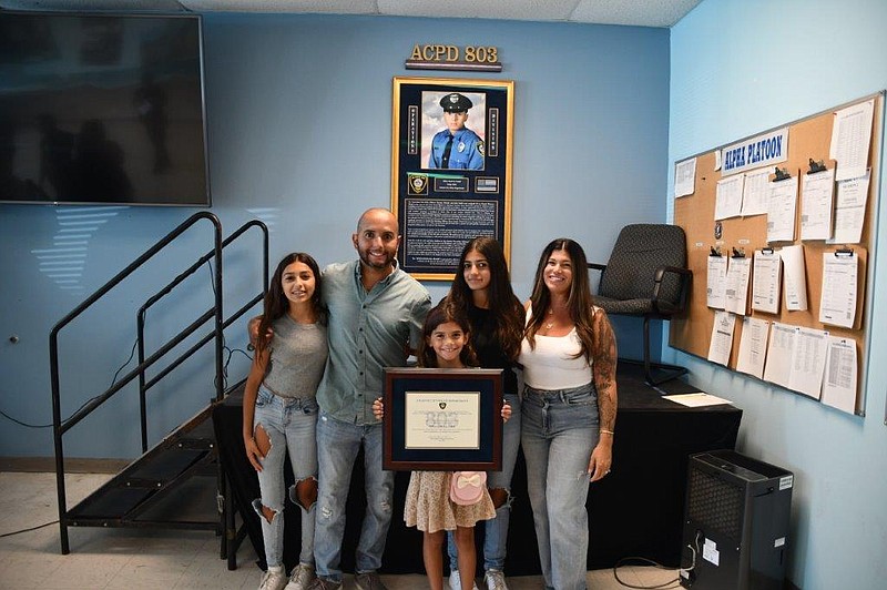 Josh Vadell with his wife, Laura, and daughters.