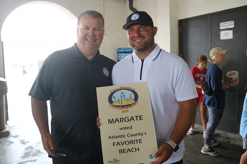 Margate representatives Superintendent of Public Works Pat Power, left, and Public Works employee Dominick Marchiani smile for a winning photo.