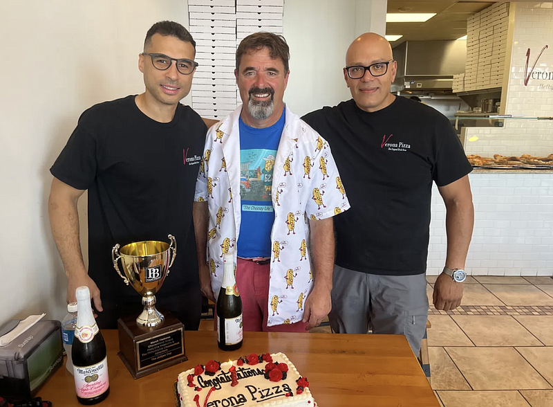 Maple Glen-based Verona Pizza is presented the 2024 March Cheesesteak Madness Judge’s Cup on July 11, 2024. Pictured, from left, is Verona Co-owner Mo Hamdi, Philadelphia Cheesesteak Adventure’s Jim Pappas and Co-owner Vincent Dipietro. (Credit: Rachel Ravina – MediaNews Group)