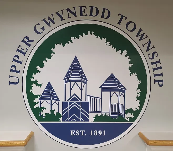 Upper Gwynedd Township’s new logo is seen on a wall in the newly renovated township administration building in April 2024.