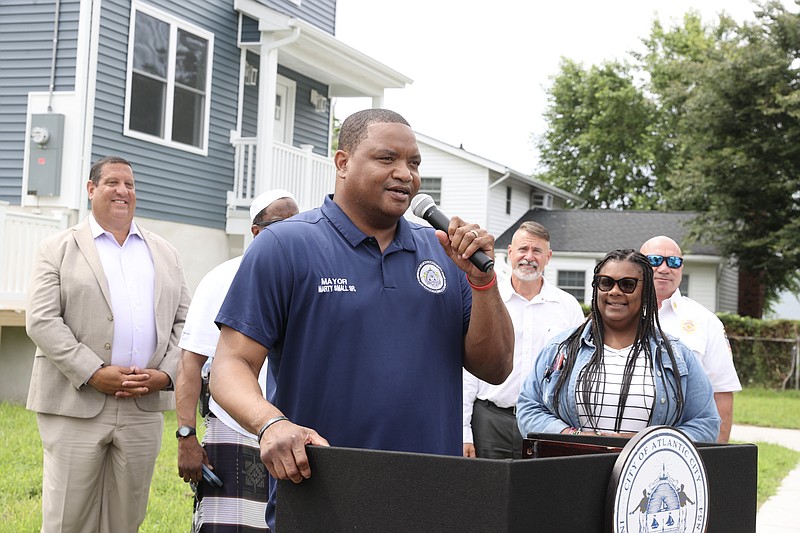 Mayor Marty Small announces the program in front of one of 10 new homes set for the first-time homebuyers.