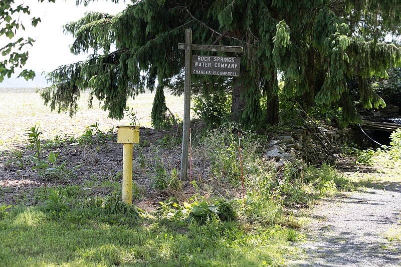 A sign for the Rock Spring Water Company, which serves about 500 properties in rural Ferguson Township. (Credit: Georgianna Sutherland / Spotlight PA)