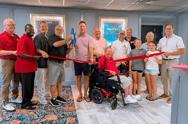 Ocean City, county and state officials along with Moorlyn Square Theatre owners, center, Brett DeNafo and Clint Bunting, officially reopen the iconic theater. (Photo courtesy of the Ocean City Regional Chamber of Commerce)