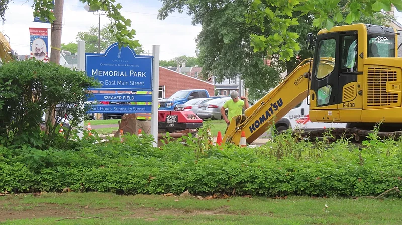 Contractors watch an excavator on Main Street as part of a long-planned streetscape project in Lansdale on June 23, 2024.