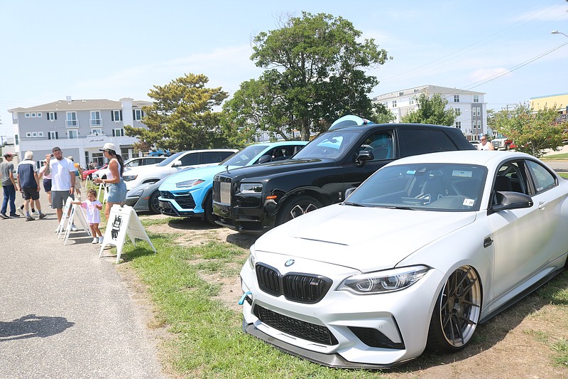 The car show features many new high-end vehicles.