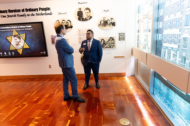 Irvin Moreno-Rodriguez, right, the director of the Sara and Sam Schoffer Holocaust Resource Center at Stockton University, gives a tour of the center on Stockton’s Galloway campus to Adrian Chrobot, a political counsellor of the Polish Embassy in Washington, D.C., on Aug. 9. (Photo Susan Allan Stockton)