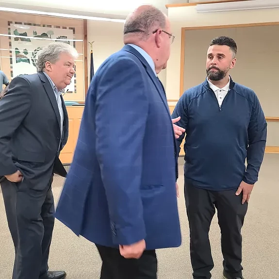 New Towamencin finance director Eric Reinbott, right, speaks to township Manager David Kraynik, center, and supervisors Chairman Chuck Wilson after Reinbott was appointed on Tuesday, Aug. 13, 2024.