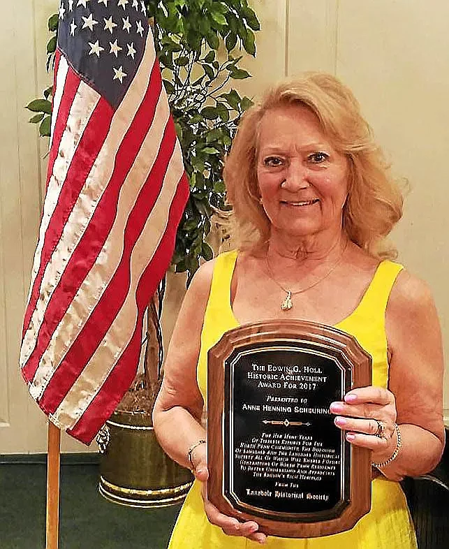 Anne Henning Scheuring poses with the Lansdale Historical Society's 2017 Edwin G. Holl Historic Achievement Award. Photo courtesy of Lansdale Historical Society.