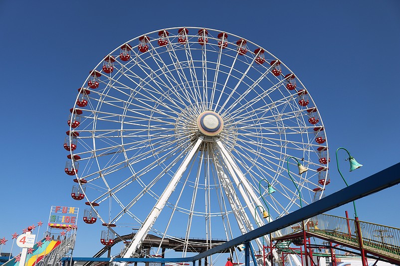 The landmark Ferris wheel soars above Wonderland Pier.