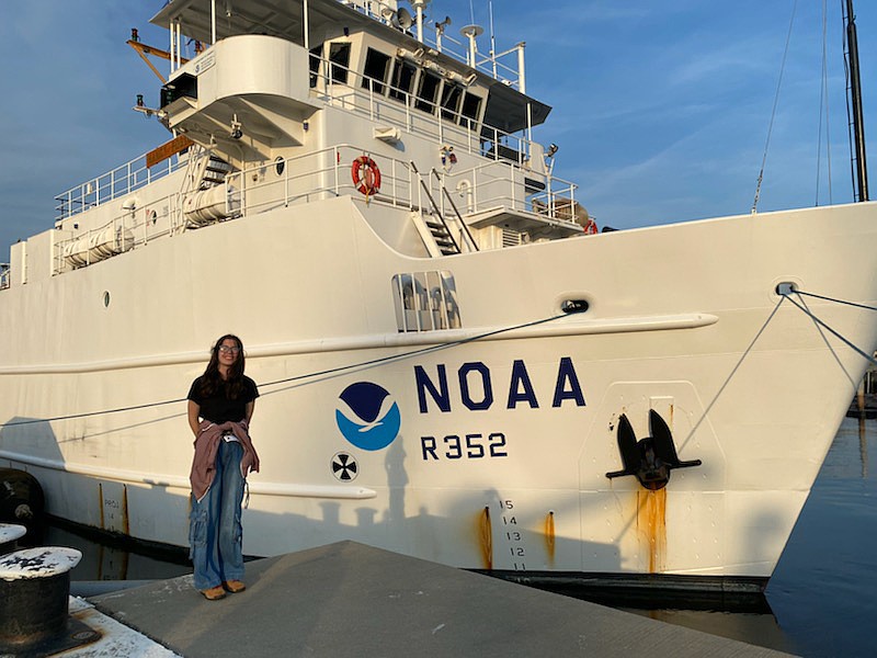 Hannah Elliott, a sophomore Marine Science major, stands in front of the NOAA vessel Nancy Foster before it leaves the Federal Law Enforcement Training Center in North Charleston, South Carolina, for the third of three week-long cruises featuring college students.