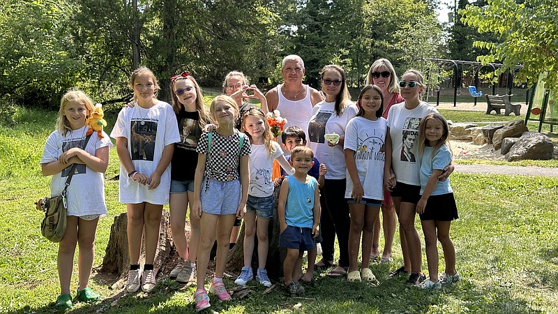 Charlie's family, far right, and members of his second families gathered in White's Road Park Tuesday afternoon to remember White's Road Park Charlie.