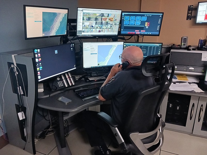 Dispatcher Daron Laricks answers a call in Sea Isle City's emergency dispatch center.