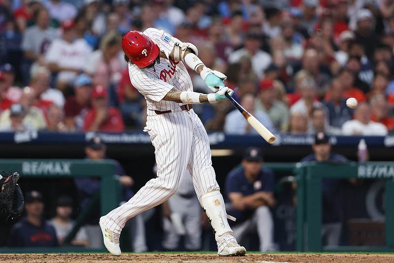 Aug 27, 2024; Philadelphia, Pennsylvania, USA; Philadelphia Phillies outfielder Nick Castellanos (8) hits a three RBI home run during the third inning against the Houston Astros at Citizens Bank Park. Mandatory Credit: Bill Streicher-USA TODAY Sports