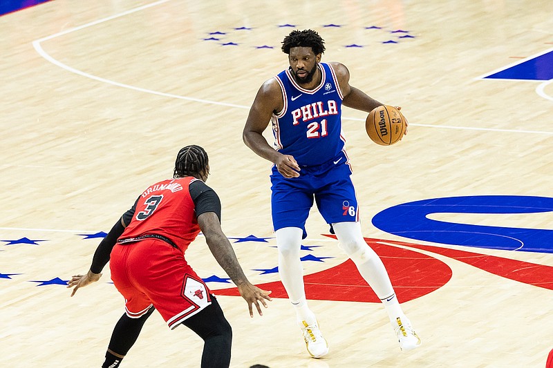 Jan 2, 2024; Philadelphia, Pennsylvania, USA; Philadelphia 76ers center Joel Embiid (21) controls the ball against Chicago Bulls center Andre Drummond (3) during the third quarter at Wells Fargo Center. Mandatory Credit: Bill Streicher-USA TODAY Sports