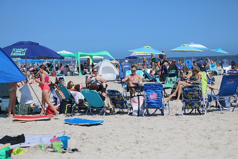 Beachgoers flock to Ocean City beaches over a busy holiday weekend.