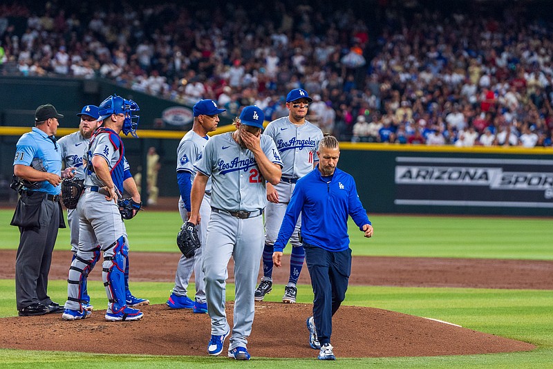 Aug 30, 2024; Phoenix, Arizona, USA;  Los Angeles Dodgers pitcher Clayton Kershaw (22) reacts after pitching change in the second inning during a game against the Arizona Diamondbacks at Chase Field. Mandatory Credit: Allan Henry-USA TODAY Sports