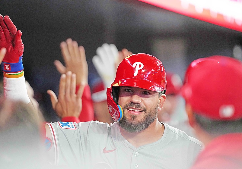 Sep 3, 2024; Toronto, Ontario, CAN; Philadelphia Phillies designated hitter Kyle Schwarber (12) hits a three-run home run and celebrates in the dugout against the Toronto Blue Jays during the ninth inning at Rogers Centre. Mandatory Credit: Nick Turchiaro-Imagn Images