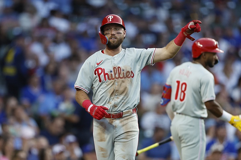 Jul 2, 2024; Chicago, Illinois, USA; Philadelphia Phillies second baseman Kody Clemens (2) celebrates after scoring against the Chicago Cubs during the second inning at Wrigley Field. Mandatory Credit: Kamil Krzaczynski-USA TODAY Sports