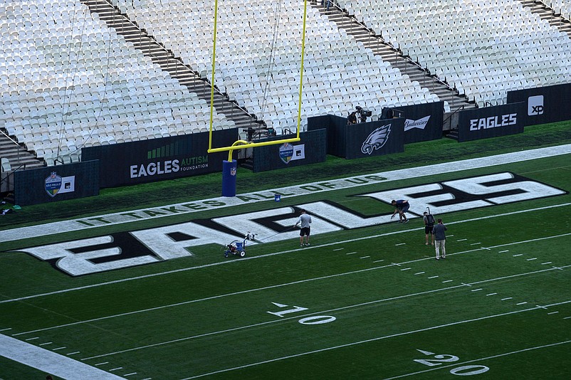 Sep 5, 2024; Sao Paolo, Brazil; Workers paint the Philadelphia Eagles logo in thee end zone prior to the 2024 NFL Sao Paolo game at Neo QuÃ­mica Arena. Mandatory Credit: Kirby Lee-Imagn Images