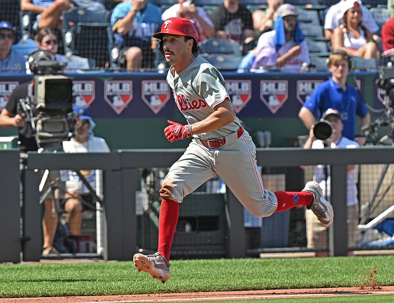 Aug 25, 2024; Kansas City, Missouri, USA;  Philadelphia Phillies catcher Garrett Stubbs (21) runs down the third baseline to score a run in the sixth inning against the Kansas City Royals at Kauffman Stadium. Mandatory Credit: Peter Aiken-USA TODAY Sports