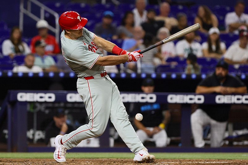 Sep 6, 2024; Miami, Florida, USA; Philadelphia Phillies catcher J.T. Realmuto (10) hits a foul ball off his leg against the Miami Marlins during the second inning at loanDepot Park. Mandatory Credit: Sam Navarro-Imagn Images