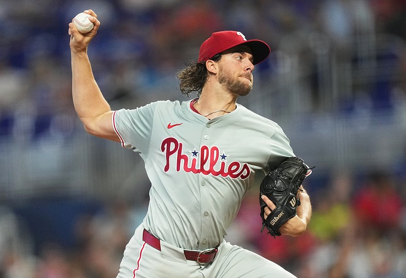 Sep 7, 2024; Miami, Florida, USA;  Philadelphia Phillies pitcher Aaron Nola (27) pitches in the first inning against the Miami Marlins at loanDepot Park. Mandatory Credit: Jim Rassol-Imagn Images