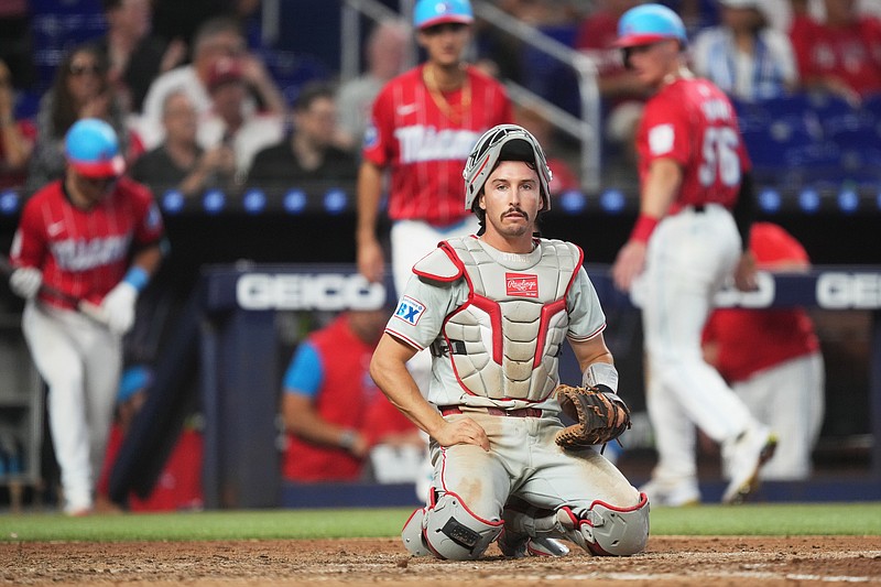 Sep 7, 2024; Miami, Florida, USA; Philadelphia Phillies catcher Garrett Stubbs (21) looks on after two runs scored for the Miami Marlins on a throwing error in the seventh inning at loanDepot Park. Mandatory Credit: Jim Rassol-Imagn Images