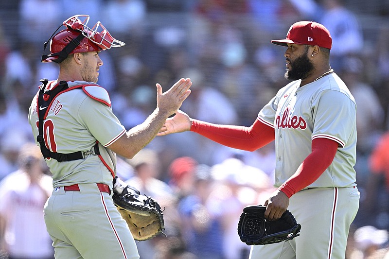 Apr 28, 2024; San Diego, California, USA; Philadelphia Phillies relief pitcher Jose Alvarado (right) and catcher J.T. Realmuto (10) celebrate on the field after defeating the San Diego Padres at Petco Park. Mandatory Credit: Orlando Ramirez-USA TODAY Sports