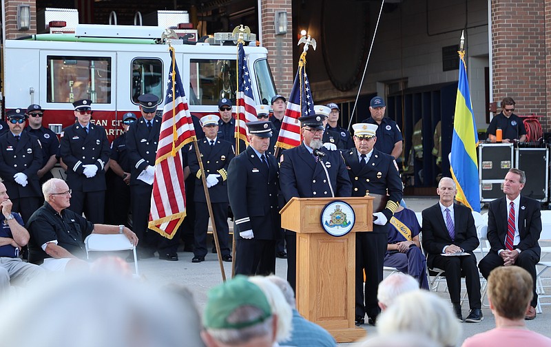 Ocean City firefighter Brian Green, standing at the podium in center, recalls the heartbreaking scene of the terrorist attacks in New York City.