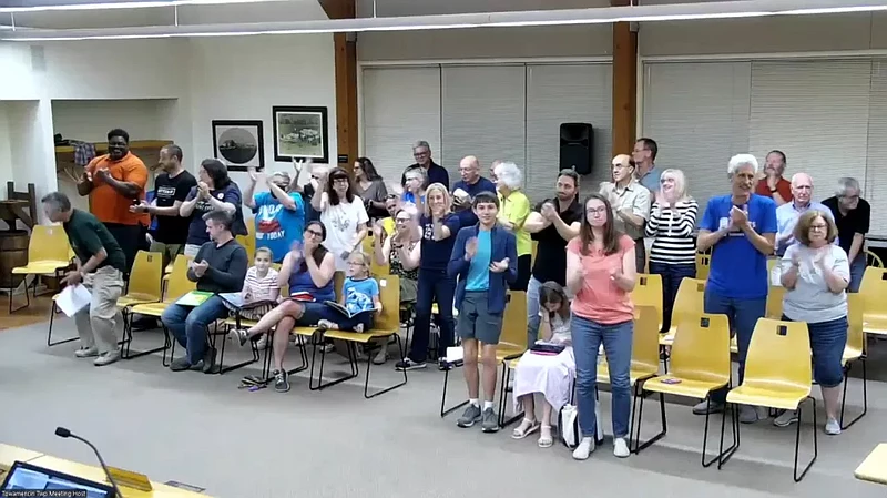 Towamencin residents give a standing ovation after the township’s supervisors voted to terminate the long-discussed sewer sale agreement on Wednesday, Sept. 11, 2024.