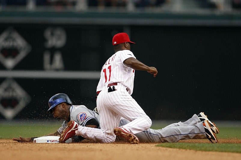 Jun 29, 2007; Philadelphia, PA, USA; New York Mets shortstop Jose Reyes (7) is tagged out while attempting to steal by Philadelphia Phillies shortstop Jimmy Rollins (11) in the seventh inning at Citizens Bank Park in Philadelphia, PA. The Mets defeated the Phillies 6-5 in the first game of a double header. Mandatory Credit: Howard Smith-USA TODAY Sports Copyright © 2007 Howard Smith