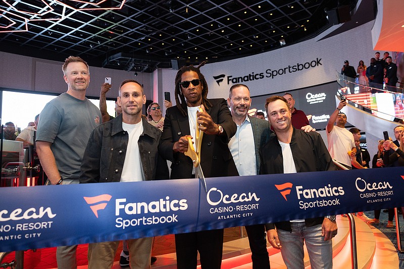 Jay-Z, center, cuts the ribbon with Matt King, Michael Rubin, Bill Callahan and Justin Thomas.                (Photo credit: Alex Subers and Shareif Ziyadat)