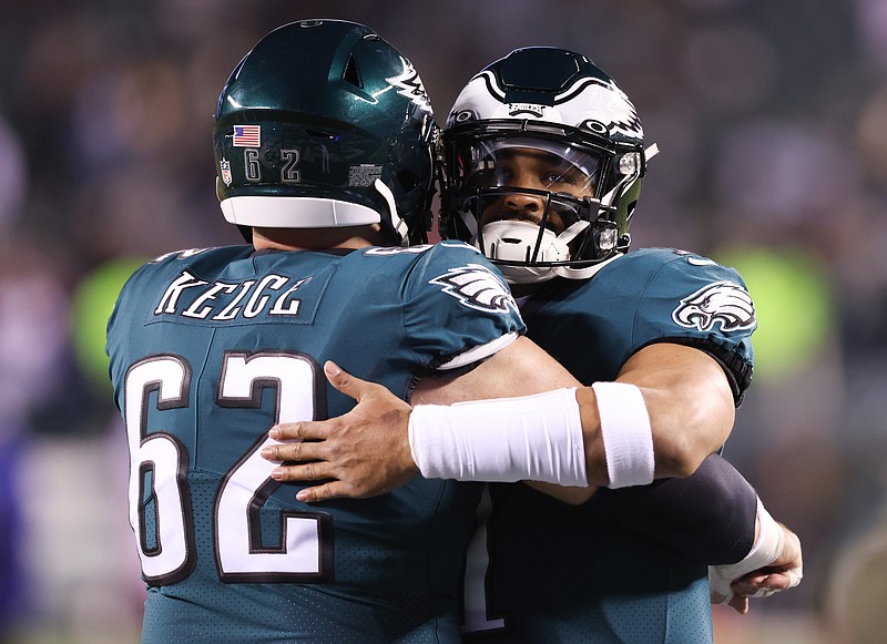 Jan 21, 2023; Philadelphia, Pennsylvania, USA; Philadelphia Eagles center Jason Kelce (62) and quarterback Jalen Hurts (1) embrace before a game against the New York Giants during an NFC divisional round game at Lincoln Financial Field. Mandatory Credit: Bill Streicher-USA TODAY Sports