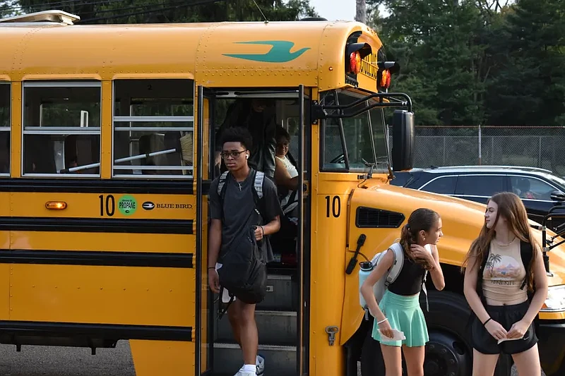 Students step down from a school bus with green “Powered by propane” markings at the first day of school at Penndale Middle School in Lansdale in Aug. 2024. (Photo courtesy of North Penn School District)