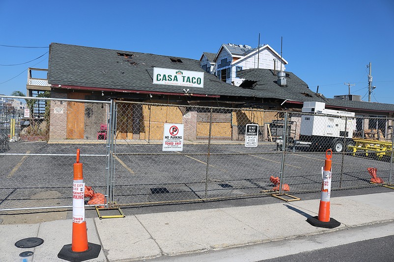 The old building had been surrounded by a chain-link fence before it was torn down.